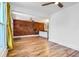 Open living space with exposed brick wall, hardwood flooring, seamlessly connecting to the kitchen at 3726 N High St, Denver, CO 80205