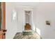 A mud room with white walls, tile floors, and a doorway leading to the rest of the home at 3726 N High St, Denver, CO 80205