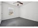 Simple bedroom with a ceiling fan and window at 6663 Zinnia St, Arvada, CO 80004