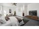 Main bedroom with ensuite bathroom and TV at 6663 Zinnia St, Arvada, CO 80004