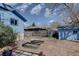 Spacious backyard featuring garden beds, shed, and partial fencing at 7761 S Wellington St, Centennial, CO 80122