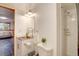 Well-lit bathroom featuring a stainless steel sink and shower at 7761 S Wellington St, Centennial, CO 80122