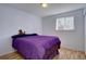 Bright bedroom with hardwood floors and a window letting in plenty of natural light at 7761 S Wellington St, Centennial, CO 80122