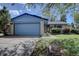 Charming exterior view of home featuring a 2 car garage, inviting front yard, and well-maintained landscaping at 7761 S Wellington St, Centennial, CO 80122