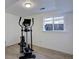 Home gym area with an elliptical machine and natural light at 7761 S Wellington St, Centennial, CO 80122