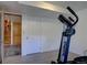 Home gym with exercise equipment and an open doorway at 7761 S Wellington St, Centennial, CO 80122