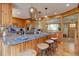 Spacious kitchen boasting a large island, stainless steel appliances, and custom wood cabinetry at 7761 S Wellington St, Centennial, CO 80122