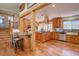 Spacious open kitchen with island, stainless steel appliances, and wood cabinetry at 7761 S Wellington St, Centennial, CO 80122