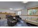 Cozy living room with a brick fireplace and comfortable seating at 7761 S Wellington St, Centennial, CO 80122