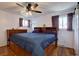 Cozy main bedroom with hardwood floors, ceiling fan, and ample natural light at 7761 S Wellington St, Centennial, CO 80122