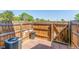 Fenced backyard area with wooden deck and air conditioning unit at 1622 S Idalia Cir # E, Aurora, CO 80017