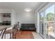 Open living space features wood floors and a sliding glass door to the outdoor space at 1622 S Idalia Cir # E, Aurora, CO 80017