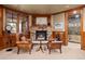 Cozy basement sitting area with fireplace and leather chairs at 10029 Whistling Elk Dr, Littleton, CO 80127