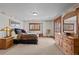 Cozy bedroom with wood dresser and access to patio at 10029 Whistling Elk Dr, Littleton, CO 80127