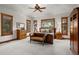 Spacious main bedroom with wood floors and large windows at 10029 Whistling Elk Dr, Littleton, CO 80127