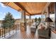 Spacious deck with wicker furniture and mountain views at 10029 Whistling Elk Dr, Littleton, CO 80127