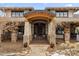 Inviting home exterior with stone accents and a covered entryway at 10029 Whistling Elk Dr, Littleton, CO 80127