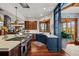 Modern kitchen with blue and wood cabinets and a large island at 10029 Whistling Elk Dr, Littleton, CO 80127