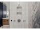 Contemporary shower with geometric patterned tiles at 10029 Whistling Elk Dr, Littleton, CO 80127