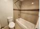 Bathroom with a combination shower and tub and ceramic tile at 8330 Zuni St # 117, Denver, CO 80221