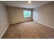 Bedroom with neutral carpet, walls and window with natural light at 8330 Zuni St # 117, Denver, CO 80221