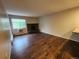 Living room featuring new floors, natural light and a fireplace at 8330 Zuni St # 117, Denver, CO 80221