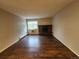 Living room featuring new floors, natural light and a fireplace at 8330 Zuni St # 117, Denver, CO 80221