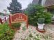 Exterior shot of the Fireside Condominiums sign with landscaped rocks, greenery, and community sign at 8330 Zuni St # 117, Denver, CO 80221