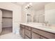 Bathroom with double sink vanity, modern fixtures, and separate water closet at 834 W 128Th Pl, Westminster, CO 80234