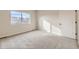 Bedroom with a large window offering natural light and neighborhood views at 834 W 128Th Pl, Westminster, CO 80234