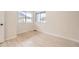 Bright, empty bedroom featuring wood-look flooring and large windows at 834 W 128Th Pl, Westminster, CO 80234