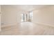 Open living space featuring sliding door access to balcony, neutral wall paint and light flooring at 834 W 128Th Pl, Westminster, CO 80234
