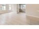 Bright living area showcases light-toned flooring and neutral walls, enhancing the sense of spaciousness at 834 W 128Th Pl, Westminster, CO 80234