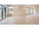 Bright living room featuring hardwood floors, natural light, and sliding door access to outdoor living at 834 W 128Th Pl, Westminster, CO 80234