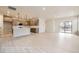 Open-concept living area boasts a seamlessly connected kitchen, promoting a spacious and inviting atmosphere at 834 W 128Th Pl, Westminster, CO 80234