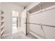 Walk-in closet with built-in shelving and racks, connected to bathroom at 834 W 128Th Pl, Westminster, CO 80234