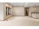 Spacious basement featuring neutral colors, carpet, and windows at 15252 W Warren Dr, Lakewood, CO 80228
