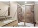 Bathroom featuring a glass enclosed tiled shower, vanity with sink, and modern fixtures at 15252 W Warren Dr, Lakewood, CO 80228