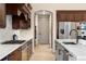 Stylish kitchen featuring stone countertops, stainless appliances, and wood cabinets at 15252 W Warren Dr, Lakewood, CO 80228