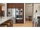 Modern kitchen features stainless steel appliances and leads to the dining area at 15252 W Warren Dr, Lakewood, CO 80228