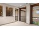 Bright loft space with stone accents, dark wood beams, and wrought iron railings at 15252 W Warren Dr, Lakewood, CO 80228