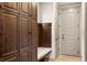 Functional mud room with built-in storage, bench seating, and convenient access to the entryway at 15252 W Warren Dr, Lakewood, CO 80228