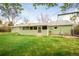 Exterior view of the back of the home, showcasing the siding and backyard at 2035 Carr St, Lakewood, CO 80214