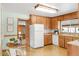 Cozy kitchen with warm wood cabinetry, ample counter space, and a dining nook, perfect for casual meals at 2035 Carr St, Lakewood, CO 80214