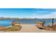 A bench overlooks a serene lake view on a sunny day with calm water at 2035 Carr St, Lakewood, CO 80214