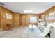 Inviting living room with classic wood paneling, comfortable seating, and neutral decor for a warm, welcoming atmosphere at 2035 Carr St, Lakewood, CO 80214