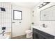 Stylish bathroom featuring black fixtures, tiled shower, and a modern vanity at 206 Troy St, Aurora, CO 80011