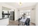 Inviting dining room adjacent to the kitchen, featuring modern decor and plenty of natural light at 206 Troy St, Aurora, CO 80011