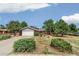 Lovely single-Gathering home with mature trees, green bushes, and an attached two-car garage at 206 Troy St, Aurora, CO 80011