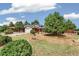 Charming home with well-maintained landscaping, mature trees, and a spacious driveway at 206 Troy St, Aurora, CO 80011